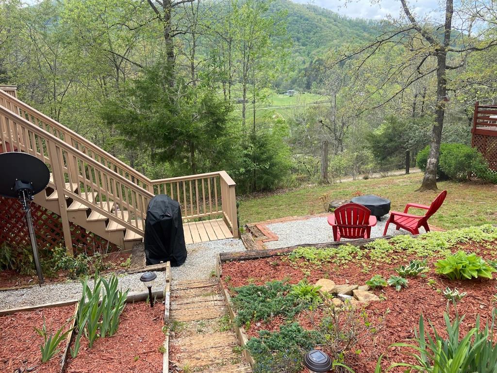 Walkway to flowers, the grill, the firepit, porch